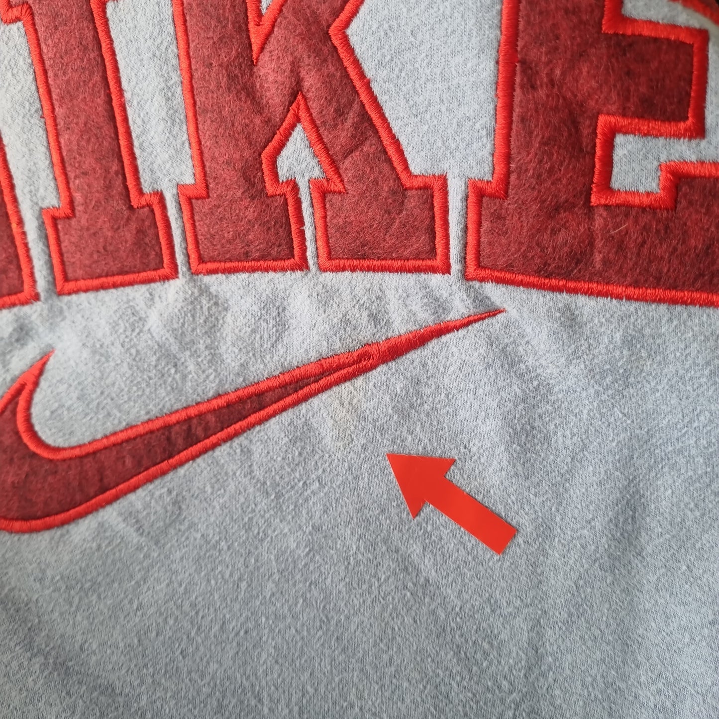 Nike reworked spell out sweater maat M